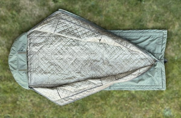Emergency waterproof sleeping bag with hypothermia monitoring access holes for first aid situations