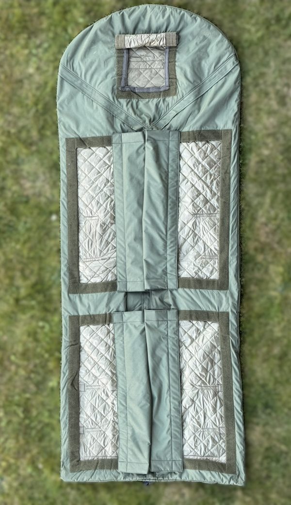Open-up view of hypothermia check pockets integrated into waterproof sleeping bag with hammock function